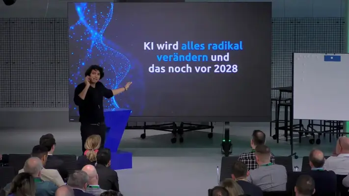 Eventfilm 1 Vortrag auf einer Veranstaltung in München mit Referent, Publikum und Präsentationsbildschirm zum Thema künstliche Intelligenz, aufgenommen von 3DMS Filmproduktion München.