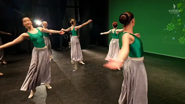 Making Of Video 4 Dancers turning on stage, filmed behind the scenes.