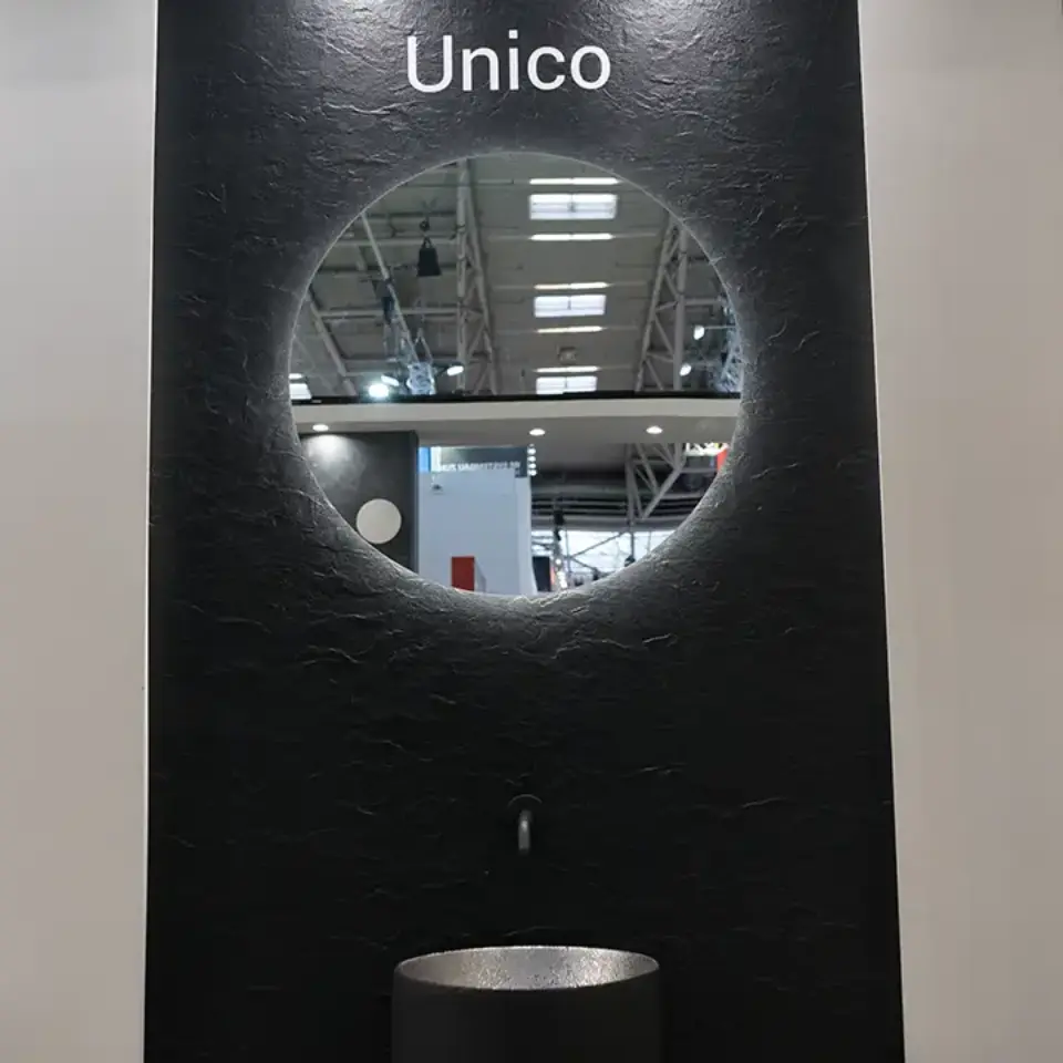 a black wall with a circular hole in it